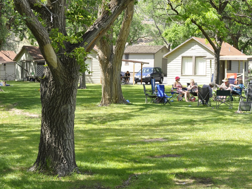 Relaxing in front of the lakeside cabins