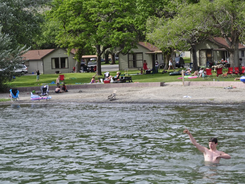 Swimming in front of the lakeside cabins
